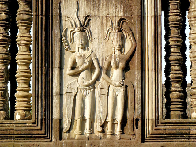 Detailed ancient stone carvings on Angkor Wat temple walls