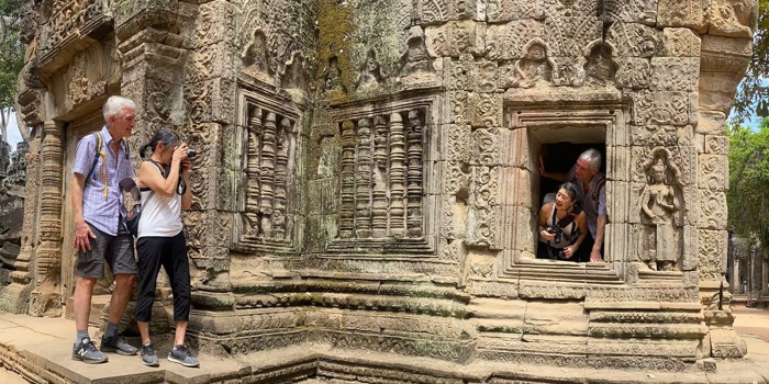 Our guests try a variety of angles take photo in Angkor Wat our-guests-take-a-photo-in-angkor-wat