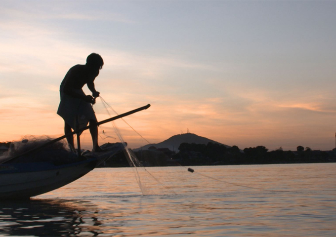 a-cambodian-fisherman-is-collecting-his-fishing-net