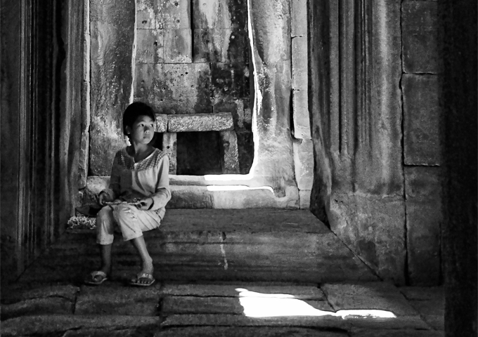 a-little-girl-sits-steadily-on-the-stone-stair