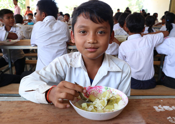 the-boy-is-enjoying-his-lunch