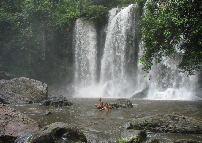 two-men-were-having-a-cool-off-beside-the-waterfall