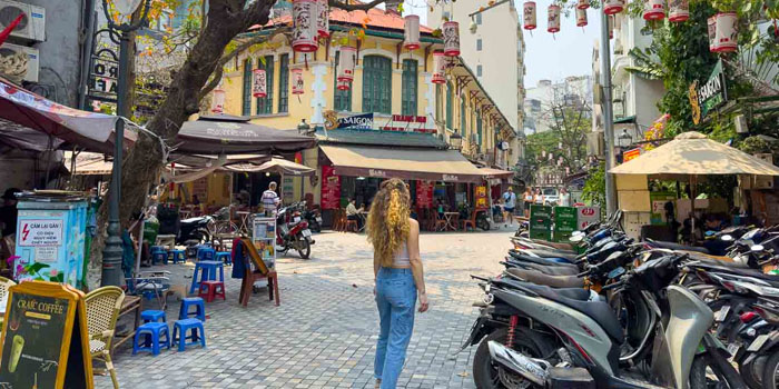 a-female-tourist-walks-alone-in-hanoi-street