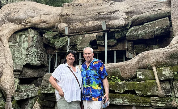 Debbie and her husband at Ta Prohm temple in Siem Reap, Cambodia