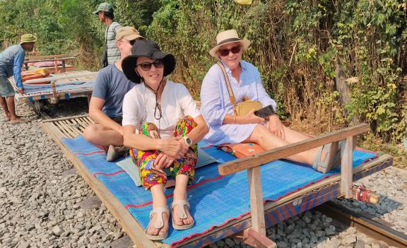 Diane and Colleen riding the Bamboo Train in Battambang, Cambodia