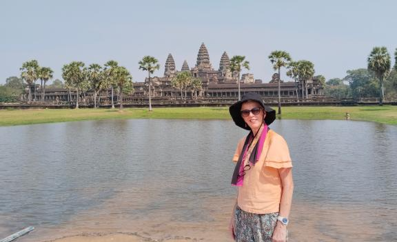 Diane standing in front of Angkor Wat in Siem Reap, Cambodia